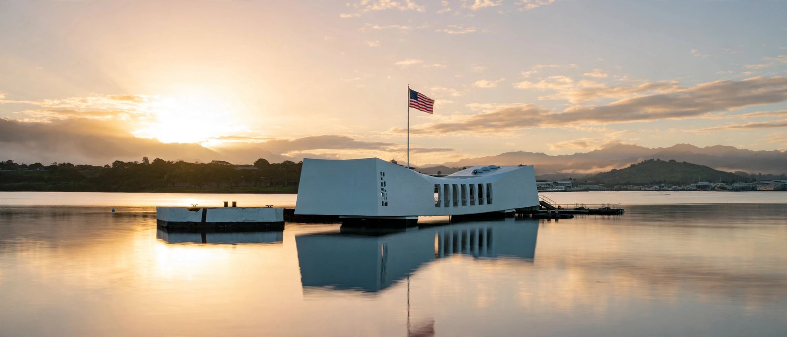 Pearl Harbor attack: the USS Arizona Memorial at sunrise over the sunken battleship
